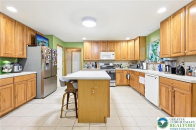 Perched atop a scenic hilltop, 136 Outlook Court offers a unique on Country Club of the Poconos Golf Course in Pennsylvania - for sale on GolfHomes.com, golf home, golf lot
