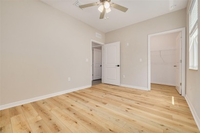 This tastefully done resort style townhome in a gated community on Gulf Harbors Golf Course in Florida - for sale on GolfHomes.com, golf home, golf lot