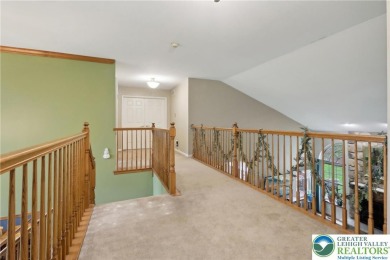 Perched atop a scenic hilltop, 136 Outlook Court offers a unique on Country Club of the Poconos Golf Course in Pennsylvania - for sale on GolfHomes.com, golf home, golf lot