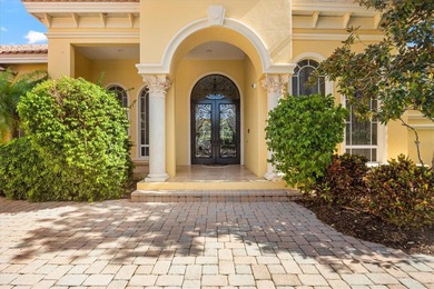 This elegant Mediterranean-style residence offers timeless on University Park Country Club in Florida - for sale on GolfHomes.com, golf home, golf lot