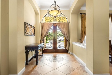 This elegant Mediterranean-style residence offers timeless on University Park Country Club in Florida - for sale on GolfHomes.com, golf home, golf lot