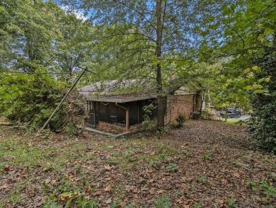 Great opportunity! Fixer-upper is just a stone's throw from on Browns Mill Golf Course in Georgia - for sale on GolfHomes.com, golf home, golf lot