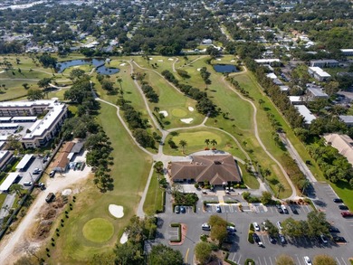 Welcome home to this beautifully cared-for 3-bedroom, 2.5-bath on Largo Golf Course in Florida - for sale on GolfHomes.com, golf home, golf lot