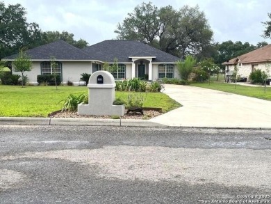 Beautifully maintained immaculate home located on the third hole on Devine Golf Course in Texas - for sale on GolfHomes.com, golf home, golf lot