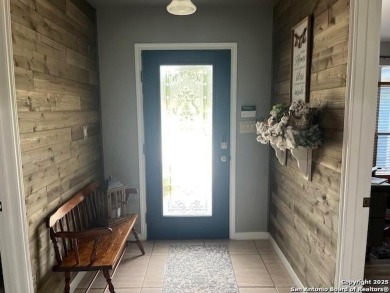 Beautifully maintained immaculate home located on the third hole on Devine Golf Course in Texas - for sale on GolfHomes.com, golf home, golf lot