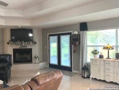 Beautifully maintained immaculate home located on the third hole on Devine Golf Course in Texas - for sale on GolfHomes.com, golf home, golf lot