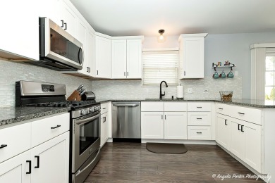 Welcome to this beautifully updated 4-bedroom, 2.5-bath home on Renwood Golf Course in Illinois - for sale on GolfHomes.com, golf home, golf lot