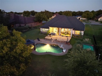 Luxury living on the golf course! Nestled along the 14th hole of on Pecan Plantation Country Club in Texas - for sale on GolfHomes.com, golf home, golf lot