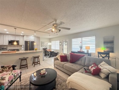 This elegant 2-bedroom 2-bathroom condo features a SPACIOUS on Hillsboro Pines Golf in Florida - for sale on GolfHomes.com, golf home, golf lot