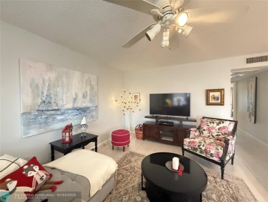 This elegant 2-bedroom 2-bathroom condo features a SPACIOUS on Hillsboro Pines Golf in Florida - for sale on GolfHomes.com, golf home, golf lot