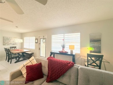 This elegant 2-bedroom 2-bathroom condo features a SPACIOUS on Hillsboro Pines Golf in Florida - for sale on GolfHomes.com, golf home, golf lot