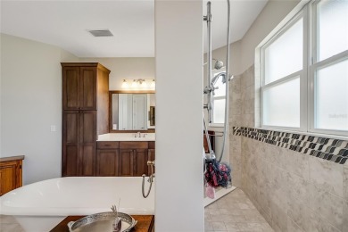 Experience luxury living in this impeccably upgraded 4 bed + on Harbor Hills Country Club in Florida - for sale on GolfHomes.com, golf home, golf lot