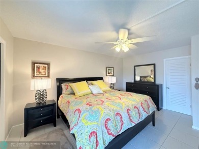 This elegant 2-bedroom 2-bathroom condo features a SPACIOUS on Hillsboro Pines Golf in Florida - for sale on GolfHomes.com, golf home, golf lot