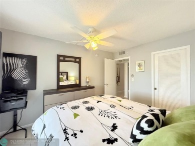 This elegant 2-bedroom 2-bathroom condo features a SPACIOUS on Hillsboro Pines Golf in Florida - for sale on GolfHomes.com, golf home, golf lot