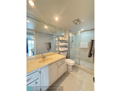 This elegant 2-bedroom 2-bathroom condo features a SPACIOUS on Hillsboro Pines Golf in Florida - for sale on GolfHomes.com, golf home, golf lot