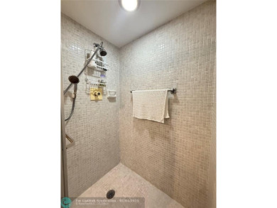 This elegant 2-bedroom 2-bathroom condo features a SPACIOUS on Hillsboro Pines Golf in Florida - for sale on GolfHomes.com, golf home, golf lot