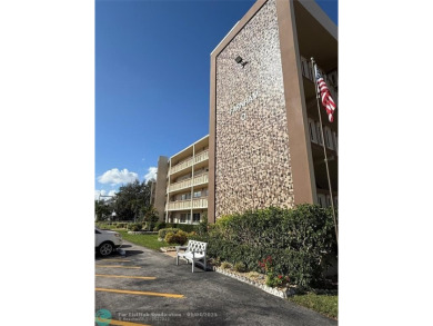 This elegant 2-bedroom 2-bathroom condo features a SPACIOUS on Hillsboro Pines Golf in Florida - for sale on GolfHomes.com, golf home, golf lot