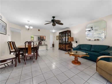 First floor unit with a lake view. 42* kitchen cabinets, granite on Pelican Pointe 9 Hole Course in Florida - for sale on GolfHomes.com, golf home, golf lot