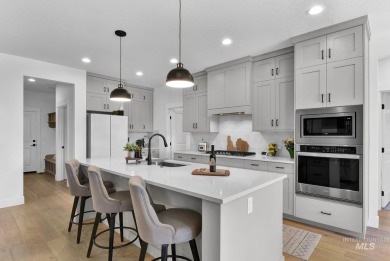 Step into refined elegance with this stunning residence in on Hunters Point Golf Club in Idaho - for sale on GolfHomes.com, golf home, golf lot