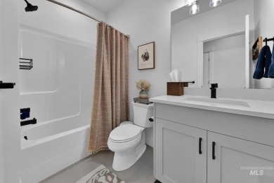 Step into refined elegance with this stunning residence in on Hunters Point Golf Club in Idaho - for sale on GolfHomes.com, golf home, golf lot