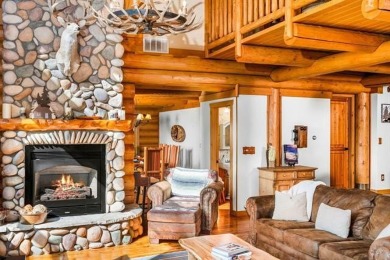 Welcome to this stunning Up North luxury log home perfectly on Boyne Mountain Resort - Monument Course in Michigan - for sale on GolfHomes.com, golf home, golf lot