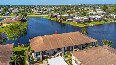 This attractive second-floor condo has stunning lake views from on Riviera Golf Club in Florida - for sale on GolfHomes.com, golf home, golf lot