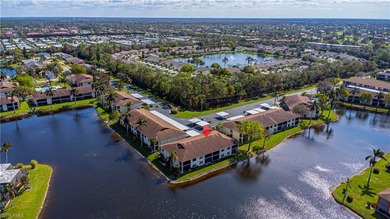 This attractive second-floor condo has stunning lake views from on Riviera Golf Club in Florida - for sale on GolfHomes.com, golf home, golf lot