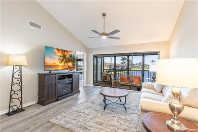 This attractive second-floor condo has stunning lake views from on Riviera Golf Club in Florida - for sale on GolfHomes.com, golf home, golf lot