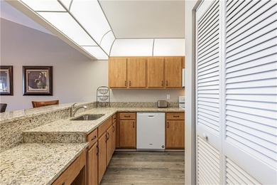 This attractive second-floor condo has stunning lake views from on Riviera Golf Club in Florida - for sale on GolfHomes.com, golf home, golf lot