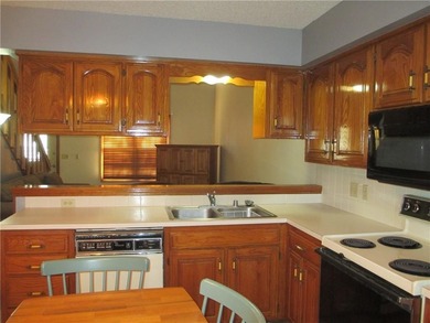 A place to stay and a place to play.  This condo offers either on Holiday Island Executive Golf Course in Arkansas - for sale on GolfHomes.com, golf home, golf lot