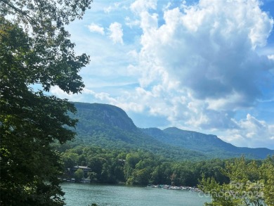 You don't want to miss this .95-acre lot in beautiful Rumbling on Rumbling Bald Resort on Lake Lure in North Carolina - for sale on GolfHomes.com, golf home, golf lot