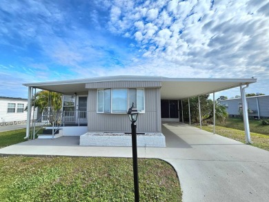 HUGE INCENTIVE, ALL LOT RENT WILL BE PAID THRU THE END OF THE on Riverbend Golf and Country Club in Florida - for sale on GolfHomes.com, golf home, golf lot