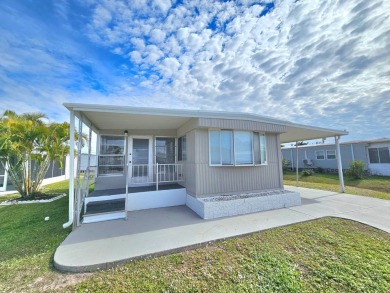 HUGE INCENTIVE, ALL LOT RENT WILL BE PAID THRU THE END OF THE on Riverbend Golf and Country Club in Florida - for sale on GolfHomes.com, golf home, golf lot