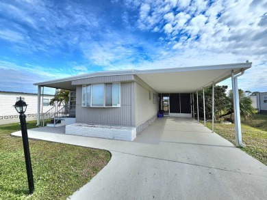 HUGE INCENTIVE, ALL LOT RENT WILL BE PAID THRU THE END OF THE on Riverbend Golf and Country Club in Florida - for sale on GolfHomes.com, golf home, golf lot