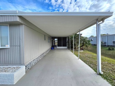 HUGE INCENTIVE, ALL LOT RENT WILL BE PAID THRU THE END OF THE on Riverbend Golf and Country Club in Florida - for sale on GolfHomes.com, golf home, golf lot