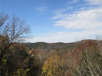 A place to stay and a place to play.  This condo offers either on Holiday Island Executive Golf Course in Arkansas - for sale on GolfHomes.com, golf home, golf lot