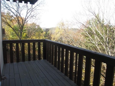 A place to stay and a place to play.  This condo offers either on Holiday Island Executive Golf Course in Arkansas - for sale on GolfHomes.com, golf home, golf lot