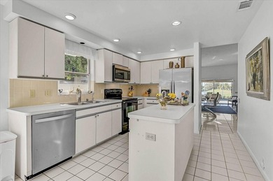 Three bedrooms, a private pool, and lake and golf course on Peridia Golf and Country Club in Florida - for sale on GolfHomes.com, golf home, golf lot