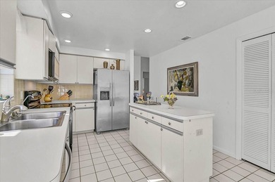 Three bedrooms, a private pool, and lake and golf course on Peridia Golf and Country Club in Florida - for sale on GolfHomes.com, golf home, golf lot