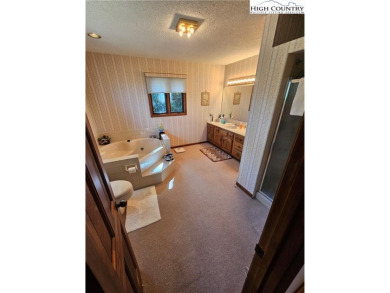 Welcome to this 3-bedroom, 3-bath mountain home with bonus room on Beech Mountain Club in North Carolina - for sale on GolfHomes.com, golf home, golf lot