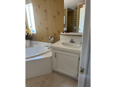 Discover Golf Course Perfection: Fully Furnished 2-Bedroom Palm on Schalamar Creek Golf and Country Club in Florida - for sale on GolfHomes.com, golf home, golf lot