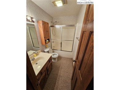 Welcome to this 3-bedroom, 3-bath mountain home with bonus room on Beech Mountain Club in North Carolina - for sale on GolfHomes.com, golf home, golf lot