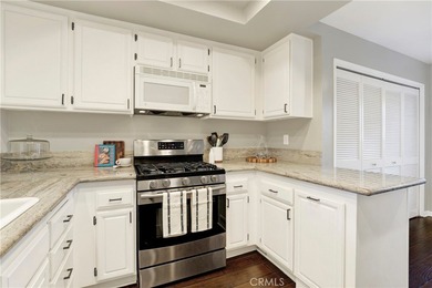 Welcome to this spacious 3-bedroom, 2-bath upper-level condo on Mission Viejo Country Club in California - for sale on GolfHomes.com, golf home, golf lot