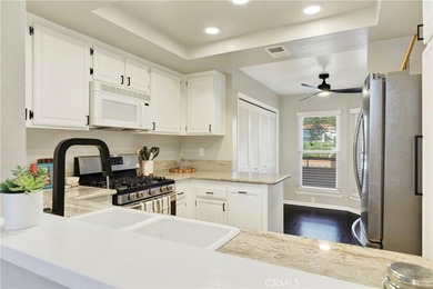 Welcome to this spacious 3-bedroom, 2-bath upper-level condo on Mission Viejo Country Club in California - for sale on GolfHomes.com, golf home, golf lot