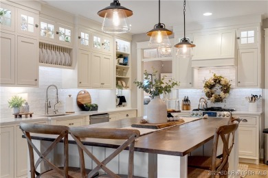 This fully remodeled home offers the perfect blend of privacy on Osage National Golf Club in Missouri - for sale on GolfHomes.com, golf home, golf lot