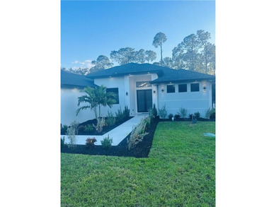 Experience the best of Golden Gate Estates living in this on The Club At Twin Eagles in Florida - for sale on GolfHomes.com, golf home, golf lot