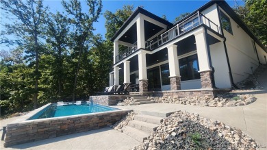 2023 construction, stunning home and is TURNKEY! Stucco & stone on The Club At Porto Cima in Missouri - for sale on GolfHomes.com, golf home, golf lot