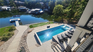 2023 construction, stunning home and is TURNKEY! Stucco & stone on The Club At Porto Cima in Missouri - for sale on GolfHomes.com, golf home, golf lot
