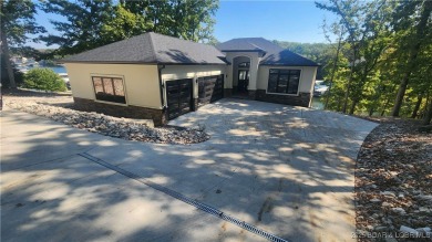 2023 construction, stunning home and is TURNKEY! Stucco & stone on The Club At Porto Cima in Missouri - for sale on GolfHomes.com, golf home, golf lot