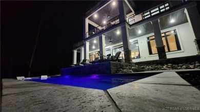 2023 construction, stunning home and is TURNKEY! Stucco & stone on The Club At Porto Cima in Missouri - for sale on GolfHomes.com, golf home, golf lot
